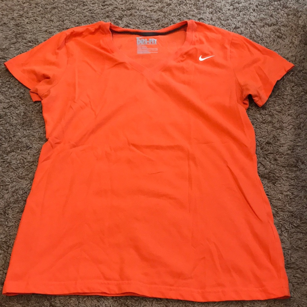 Women’s Nike orange dri-fit size L. Like new
